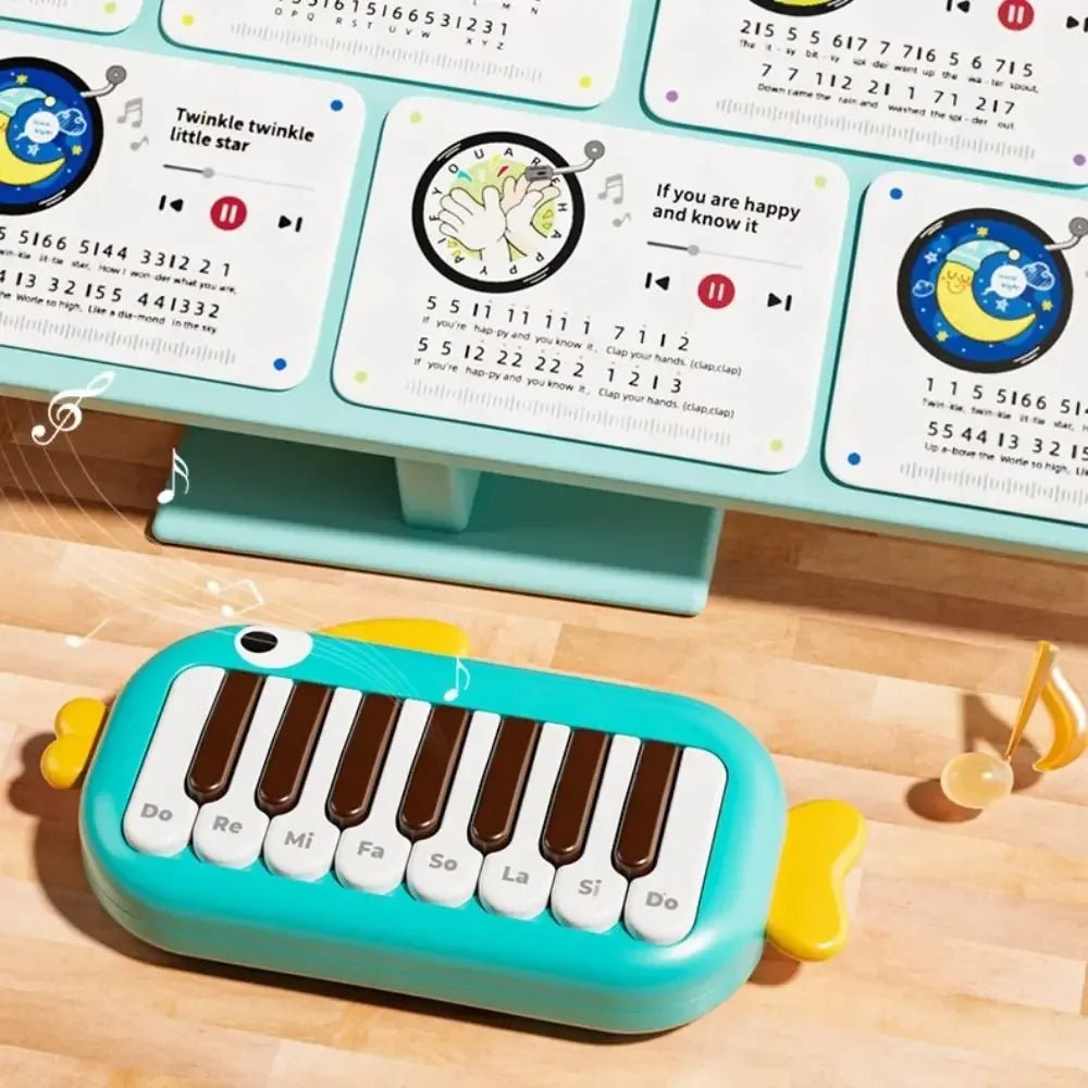 Teal and yellow baby music instruments montessori electronic piano toy with brown keys labeled with musical notes for kids learning