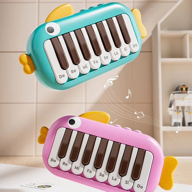 Two colorful fish-shaped baby music instruments montessori electronic keyboards in teal and pink for toy learning educational use