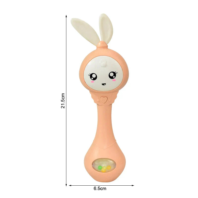 Peach-colored plastic baby music teether shaped like a bunny with white ears for education mobile cot and crib infant pacifier use