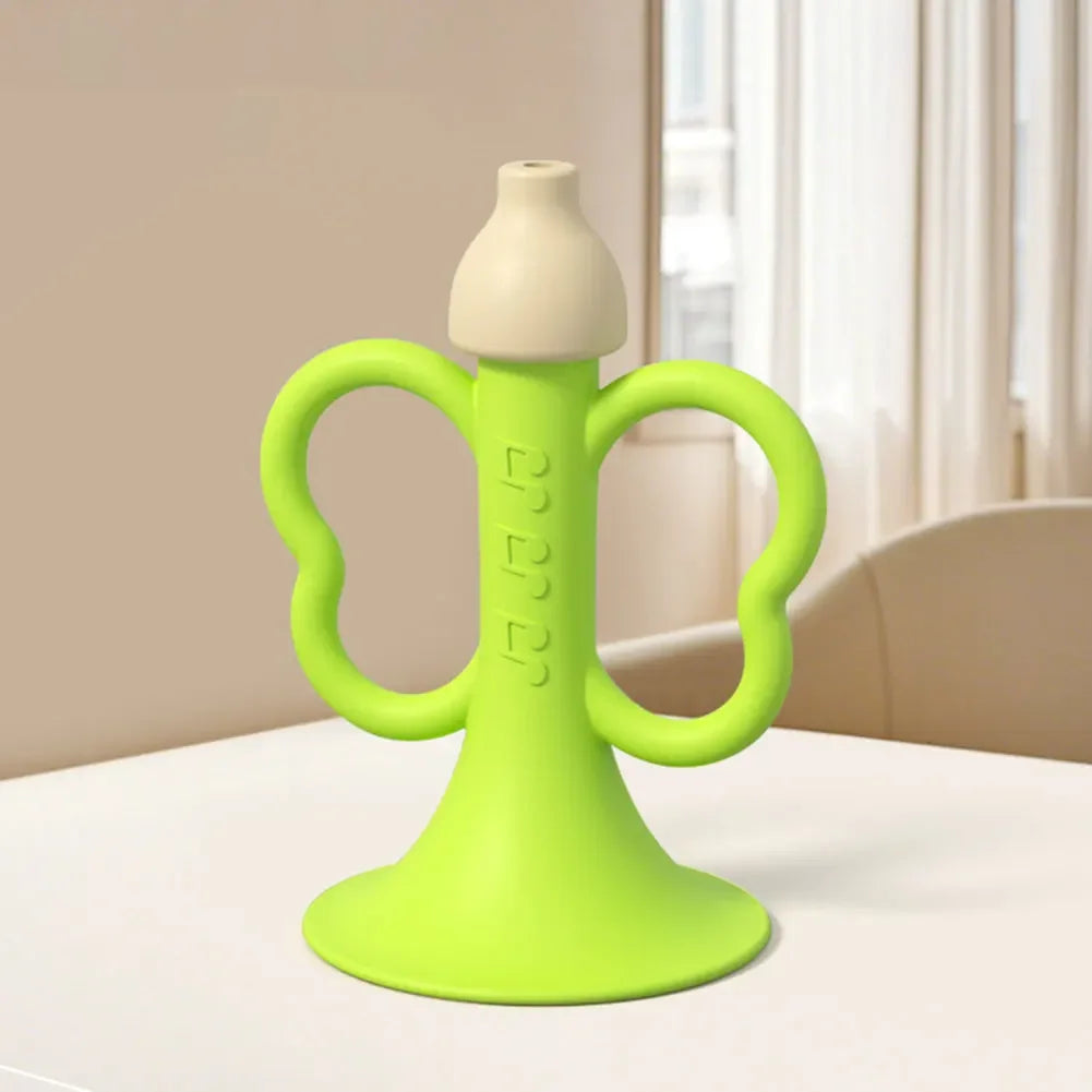 Bright lime green silicone baby teether with white nipple top and butterfly handles for children early montessori use