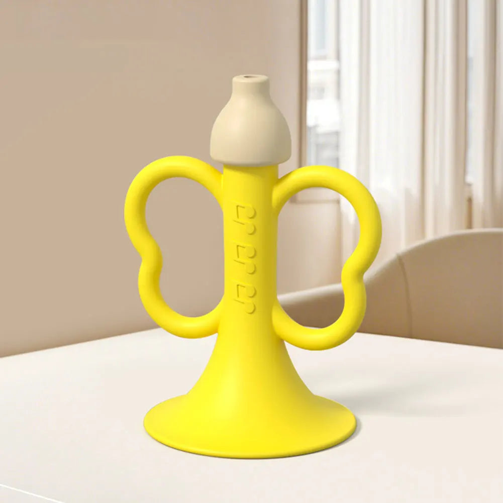 Bright yellow silicone baby teether shaped like a banana with handles for children early montessori educational toy use