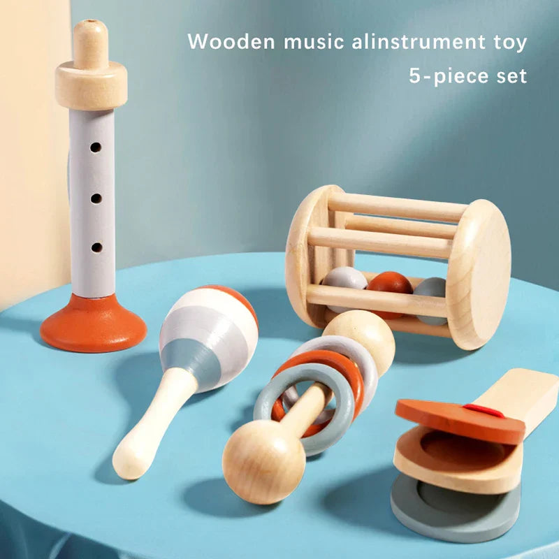 Wooden music toys montessori set with flute orange base, blue striped maracas, clappers, and ball-in-wheel rattler for toddlers