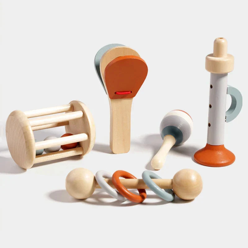 Wooden baby rattle with light wood handle and colorful orange gray white rings for music toys montessori and educational toys birthday