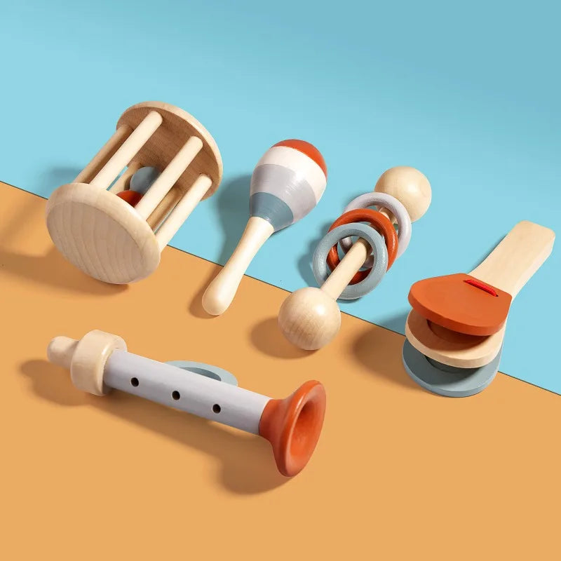 Wooden music toys montessori in pastel and terracotta tones featuring a tambourine with blue and white rings for toddler education