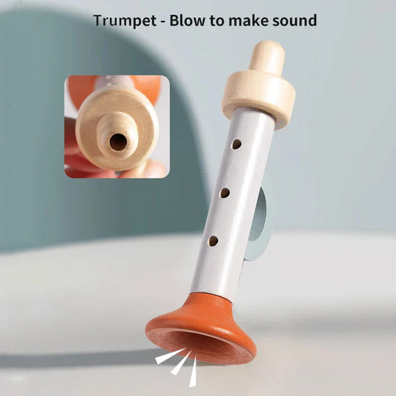 Wooden and orange plastic toy trumpet with silver metal body and three finger holes for child percussion instruments and montessori music toys