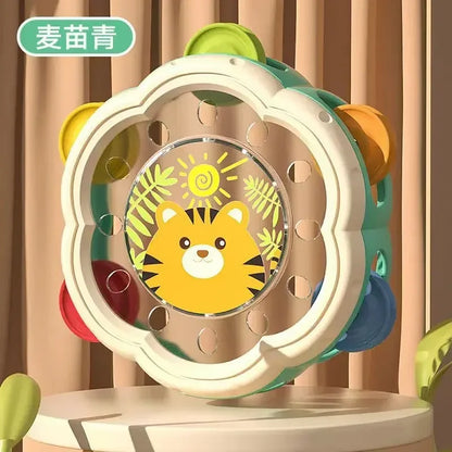 A colorful flower-shaped baby musical instrument rattle with a yellow tiger face for hand development interactive play