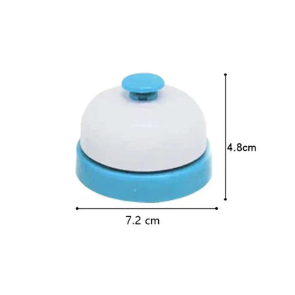 A compact two-toned plastic service bell with white dome and light blue base for baby musical instruments hand development interactive use