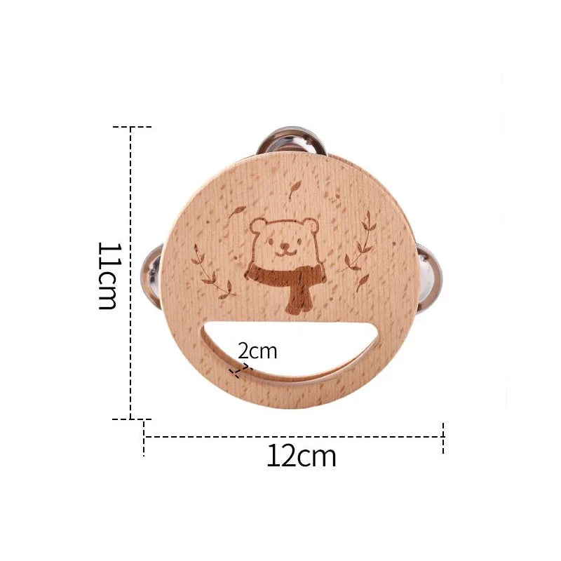 Round wooden bear rattle with carved bear and silver rings, a baby musical toy and educational instrument plaything