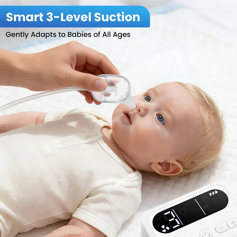 Clear plastic baby nasal aspirator electric with soft rounded tip gently applied to infant nose for nose booger suction