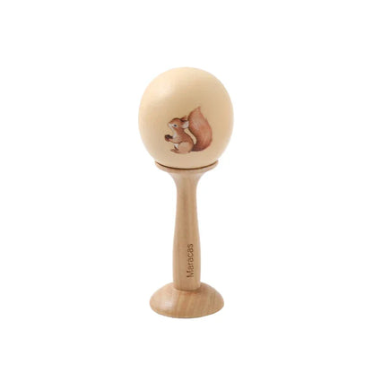 A light wood maraca baby rattle toy with a painted brown squirrel design wooden montessori toys animal xylophone baby