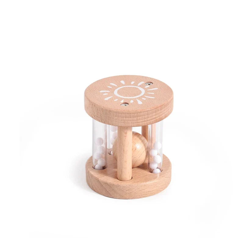 Light-colored wooden baby rattle with sun design and clear tubes with white beads wooden montessori toys animal xylophone baby