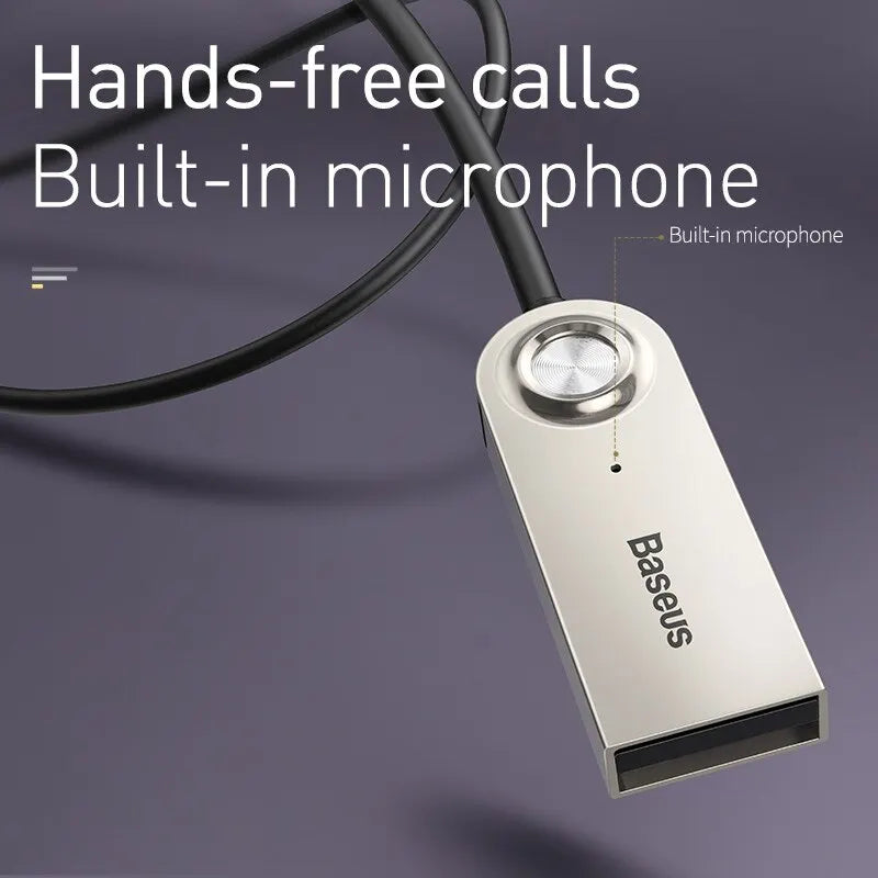 Silver baseus BA01 aux USB bluetooth adapter with circular microphone button and black cable for receiver speaker audio