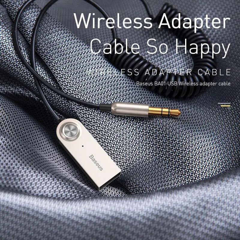 Silver and gold Baseus BA01 aux USB Bluetooth adapter cable with coiled black cord for receiver speaker audio and music receiver