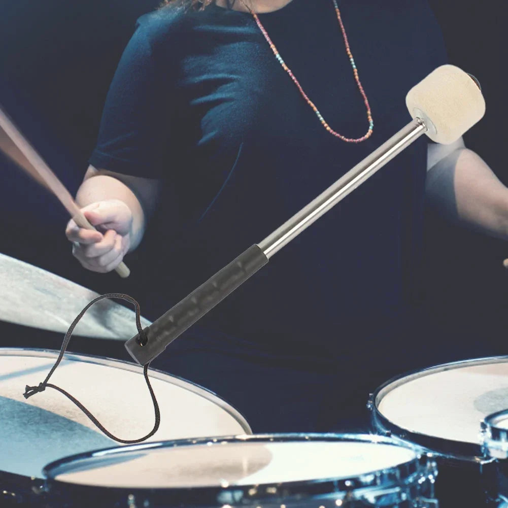 A sleek metallic bass drum mallet with a white foam marching bass felt head and black grip with hanging rope musical accessory