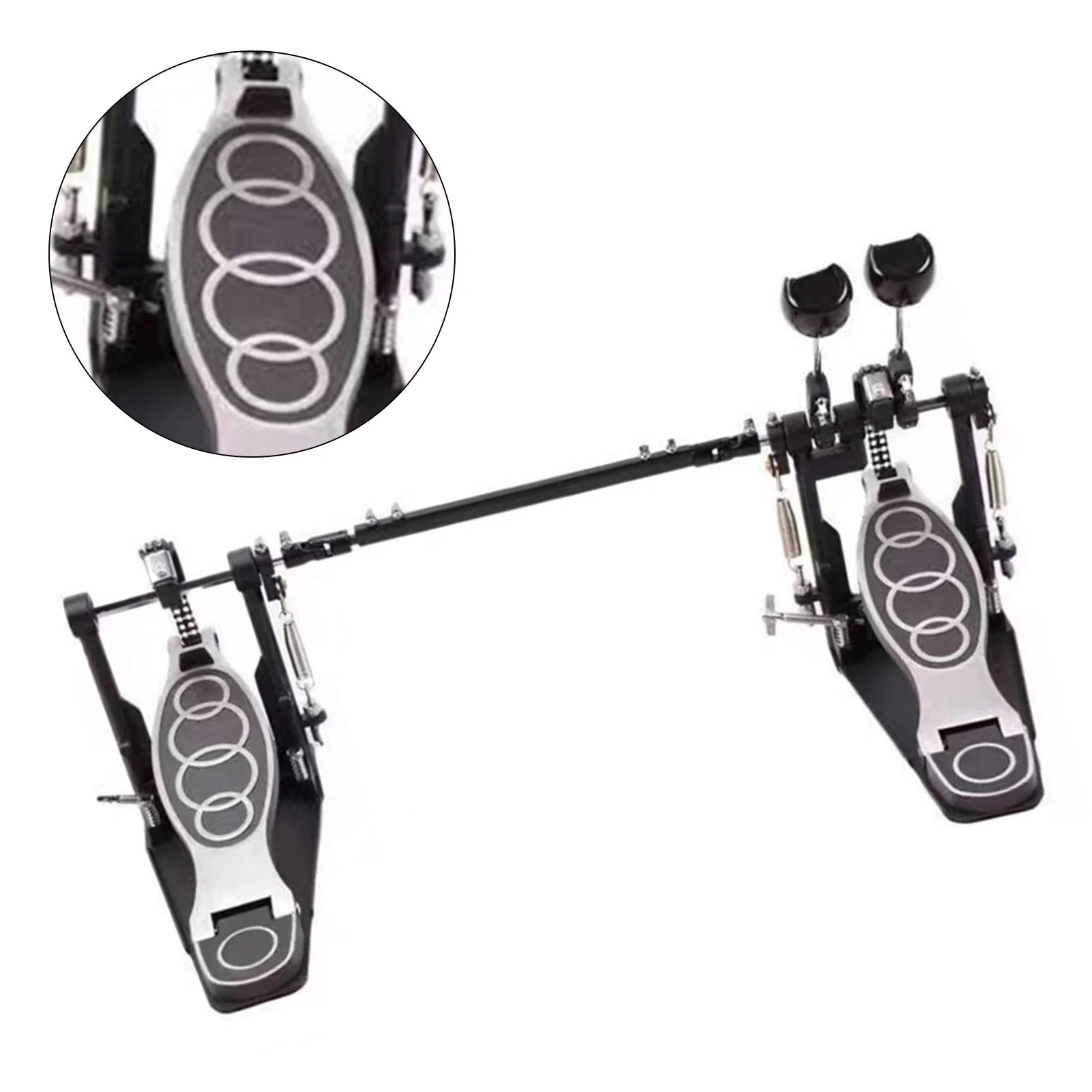 Black and silver zinc aluminum double drum pedal with circular grip patterns on footplates for stable powerful drumming