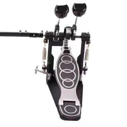 Black and silver zinc aluminum double drum pedal with firm grip circular patterns for stable powerful drumming