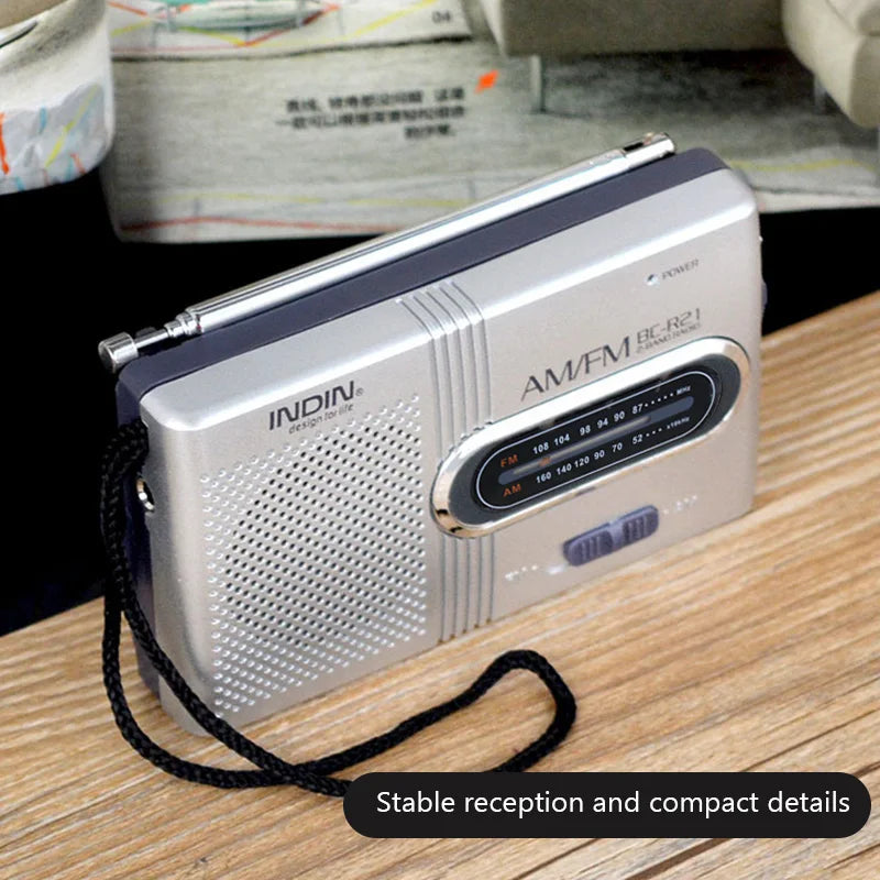 Silver and black bc-r21 portable am fm radio receiver player built-in speaker with telescopic antenna and 3.5mm headphones handheld lightweight ultra