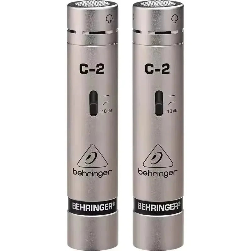 A pair of silver behringer c-2 matched condenser microphones with cardioid pickup pattern for stereo studio recording