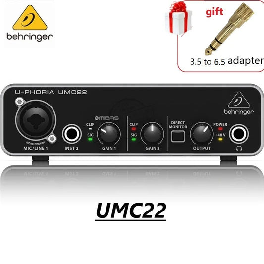 Black behringer umc22 sound card audio interface with silver trim and control knobs for gain output and direct monitor settings