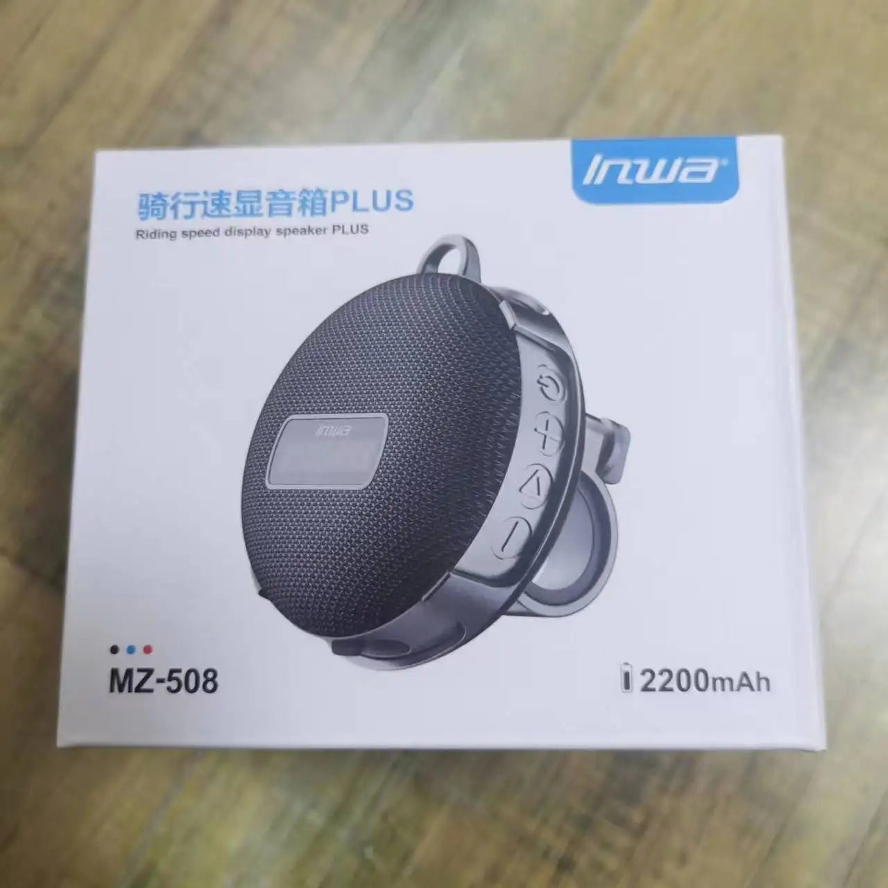 Black mesh-textured bicycle portable bluetooth speaker plus silver accents with carrying loop wireless mini subwoofer column