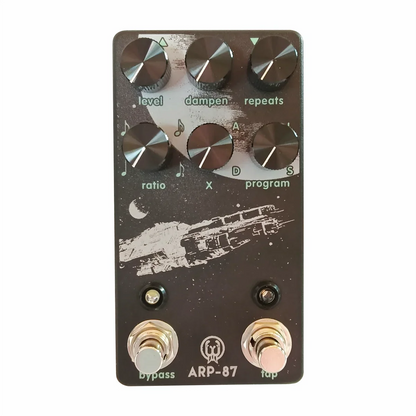 Black jhs arp-87 guitar effects pedal with silver knobs and white space ship graphic for timing speed measurement