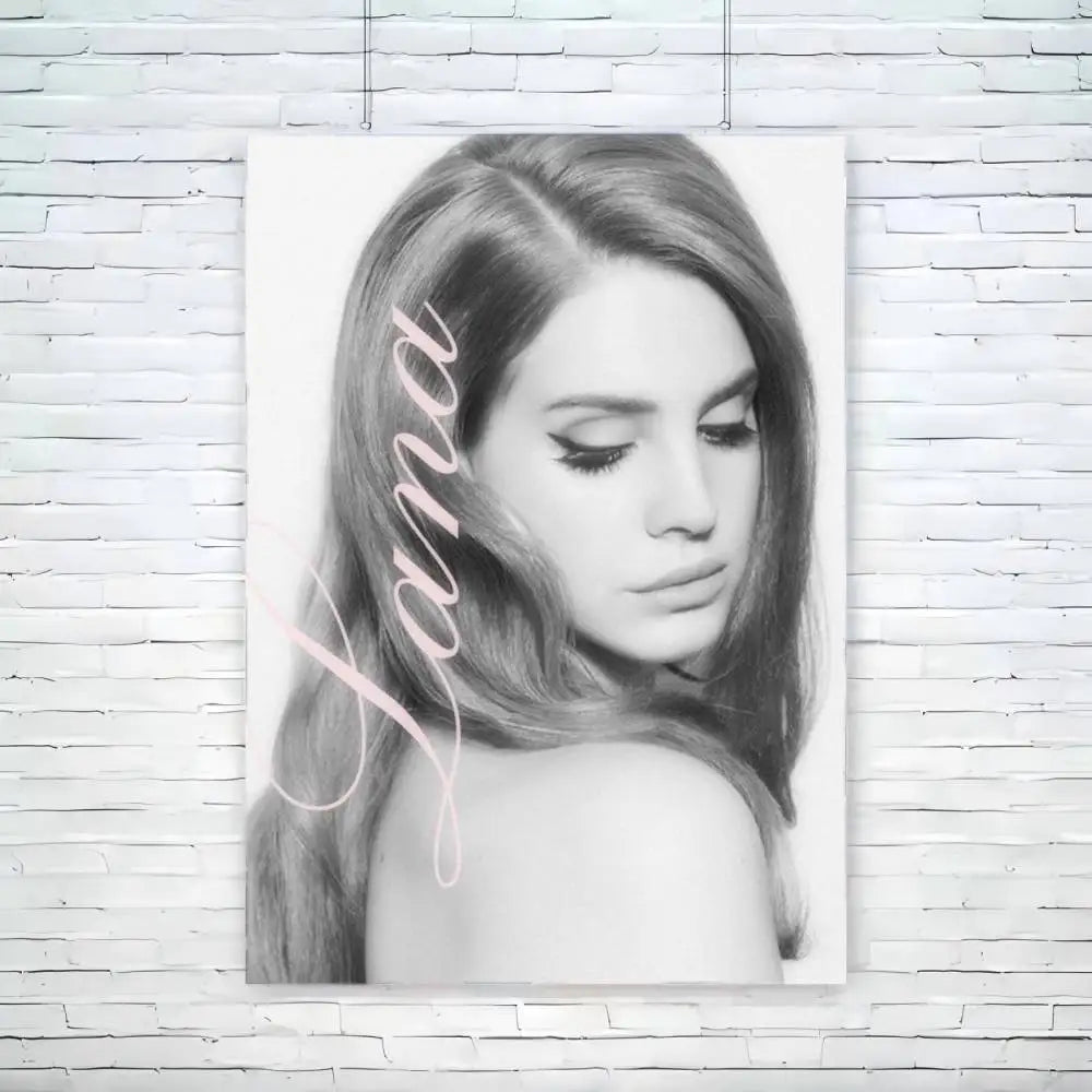 Black-and-white portrait canvas of lana del rey with soft pink cursive name featuring size reference for wall decor