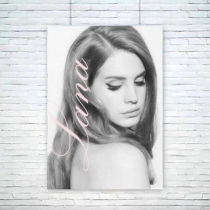 Black-and-white portrait canvas of lana del rey with soft pink cursive name featuring size reference for wall decor