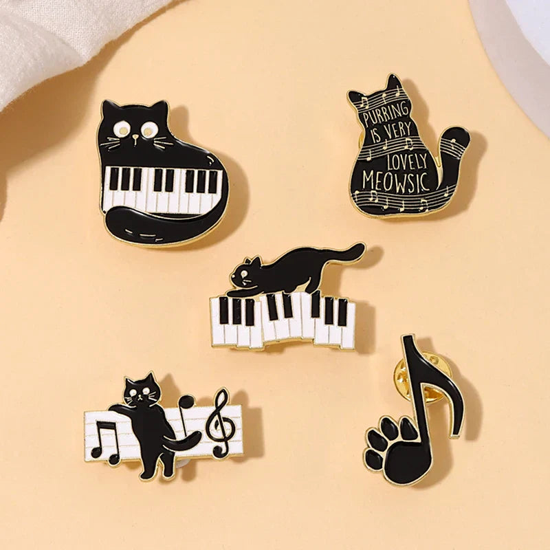 Set of five black cat music enamel pins featuring animal cute musical piano brooch badge designs with notes