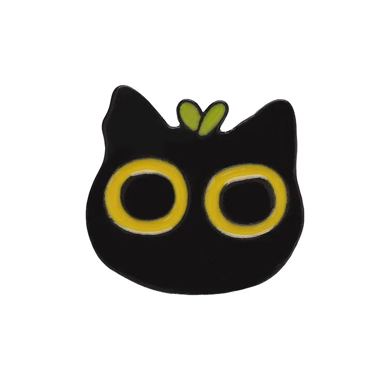 Black cat music enamel pin with bright yellow eyes and green leafy tuft animal cute musical piano brooch badge