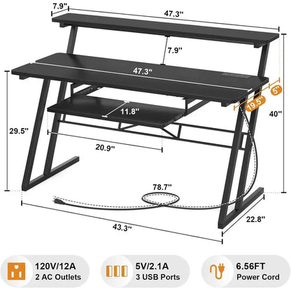 Black metal music production desk with dual shelves angled legs and power outlet for type beat music use