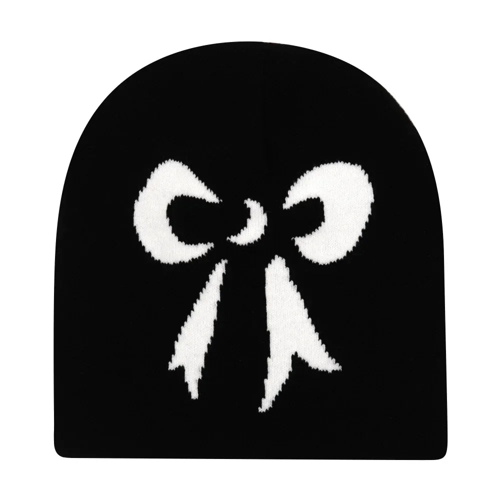 Black knit hat featuring a prominent white knitted bow design warm beanies women for skiing beanie outdoor use