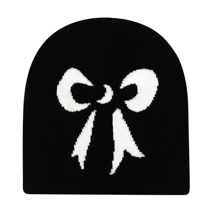 Black knit hat featuring a prominent white knitted bow design warm beanies women for skiing beanie outdoor use