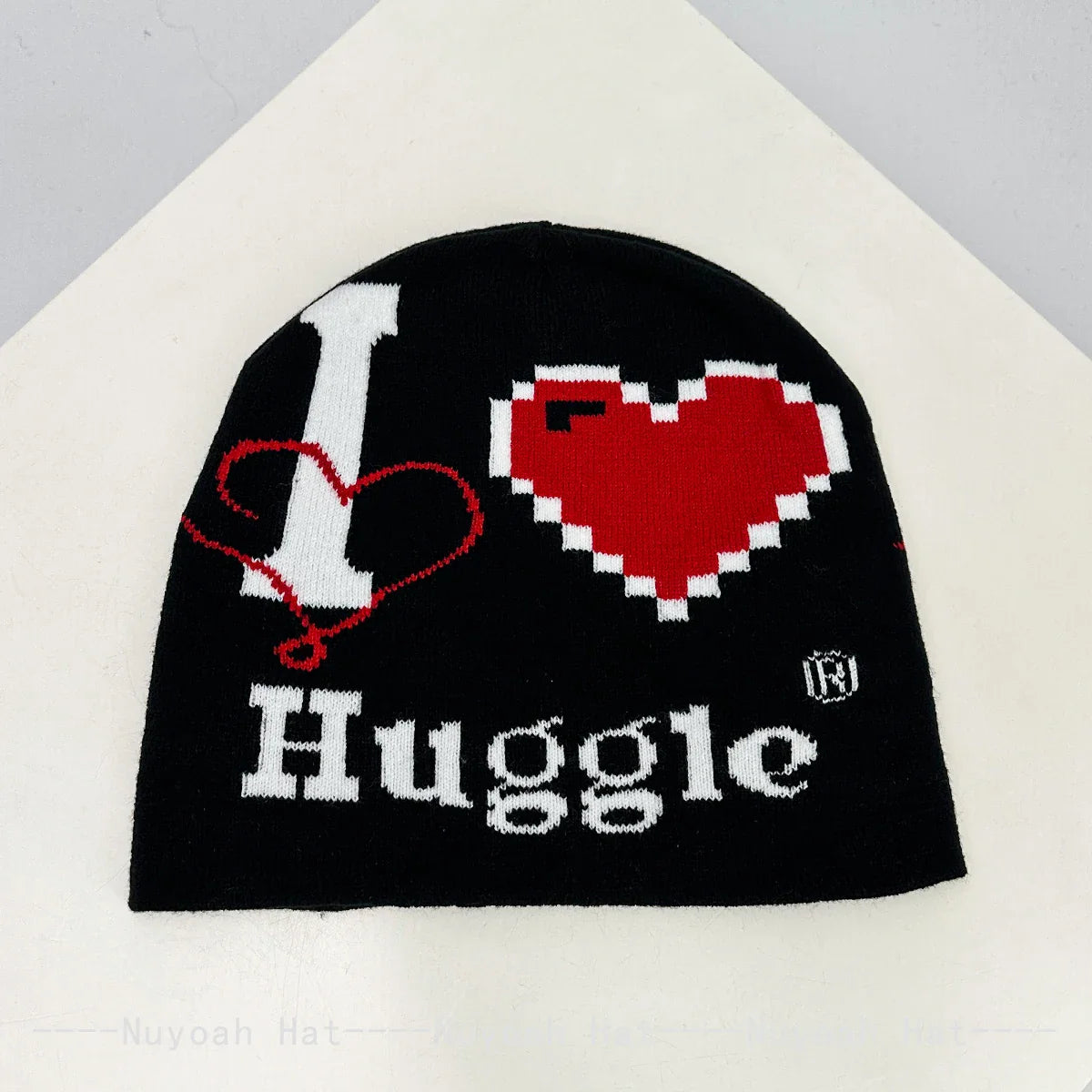 Black knit hat featuring a pixelated red heart and warm beanies women design ideal for skiing beanie outdoor use