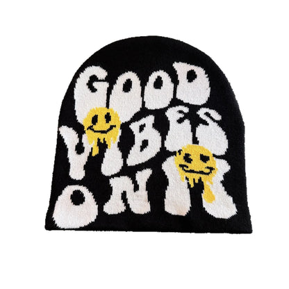 Black knit hat featuring good vibes only lettering with yellow dripping smiley faces warm beanies women skiing beanie outdoor