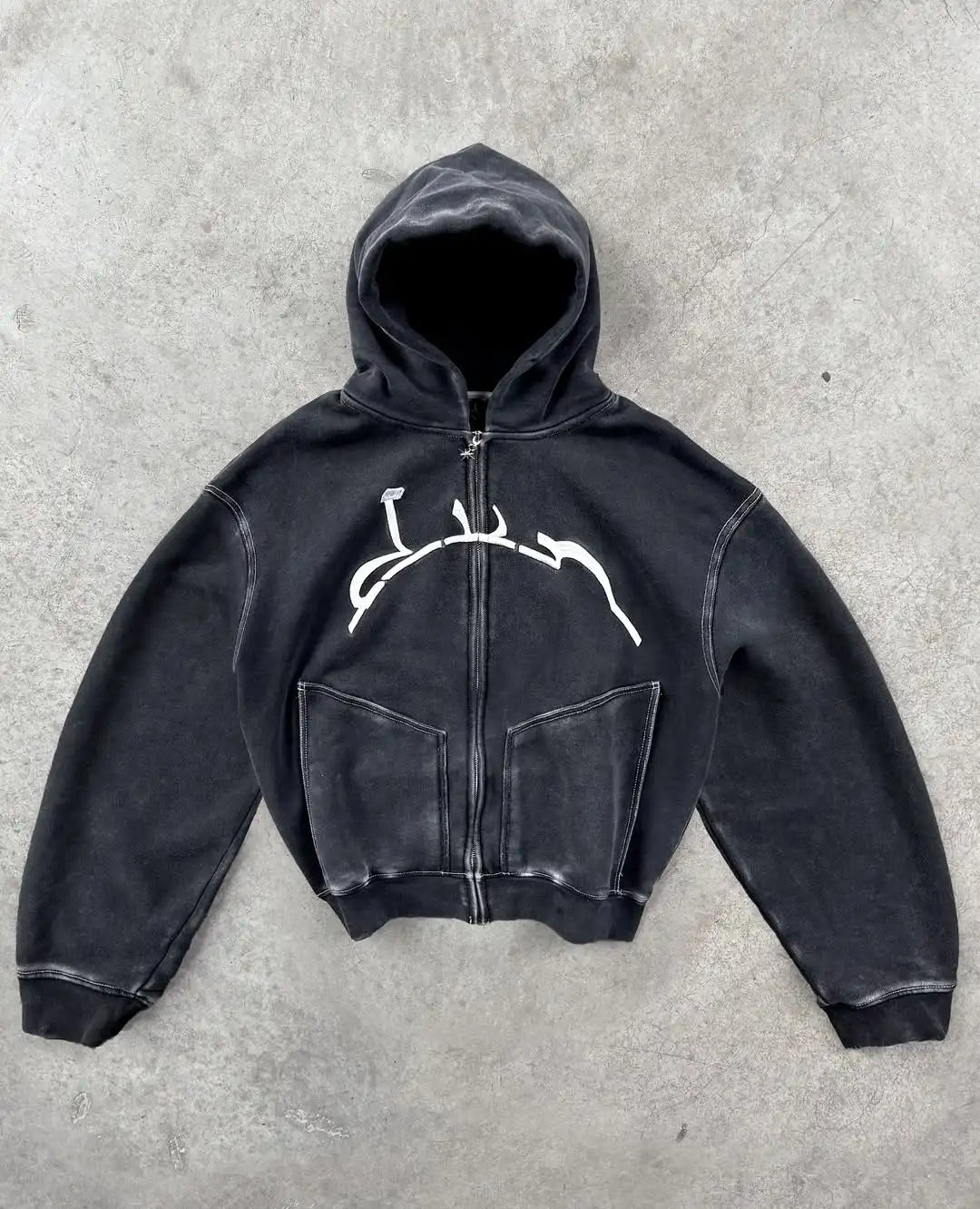 Black zip-up hoodie with white abstract graphic on chest and front pockets in harajuku hip hop style fashion