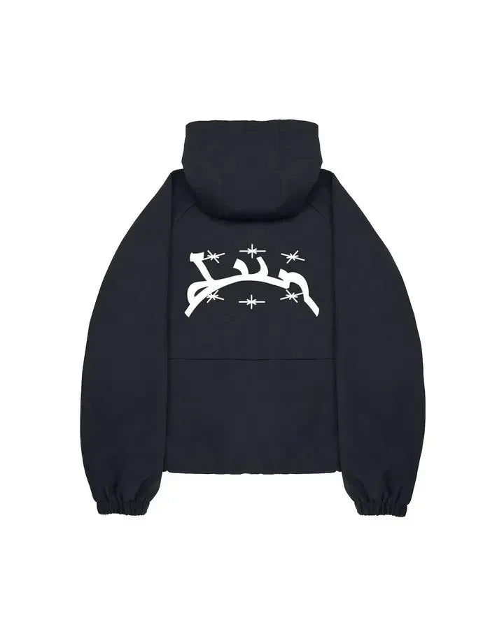 Black hooded sweatshirt with white arabic script and starburst graphics on the back in harajuku hip hop style