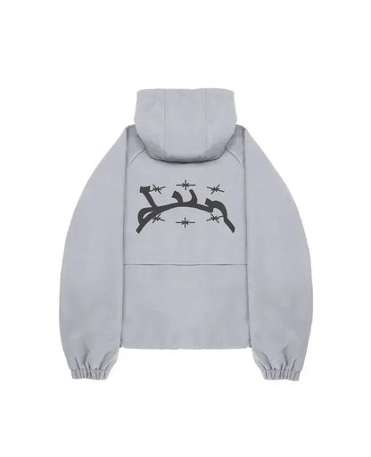 Back side of a light gray hooded jacket with black barbed wire and star graphic for harajuku hip hop fashion