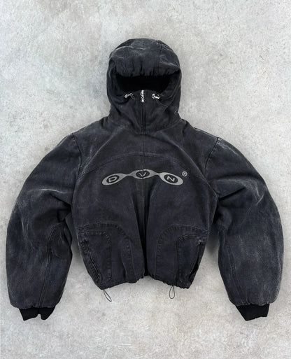 Black distressed denim hooded jacket with silver dvn logo across the chest in harajuku hip hop style