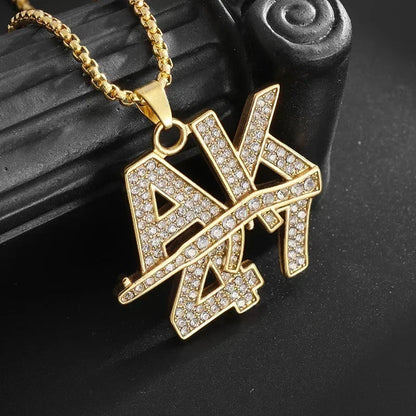 Gold-colored bold ak savage pendant cubic encrusted with clear rhinestones on a matching gold chain for rap party jewelry