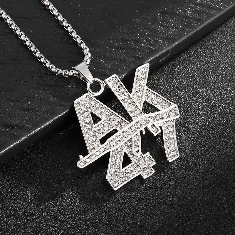 Silver chain necklace with a rhinestone encrusted ak pendant featuring cubic zirconia for rap party jewelry and savage pendant cubic style