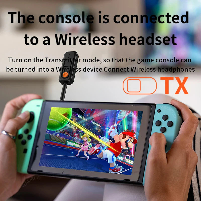 A teal nintendo switch with a black aux hd hifi music wireless adapter attached showing mario kart gameplay