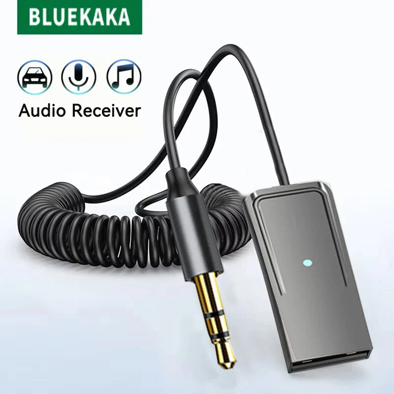 Black coiled cable with gold-plated 3.5mm jack connected to silver-gray bluetooth 5.5 car aux wireless adapter stereo unit with blue led car bt transmit
