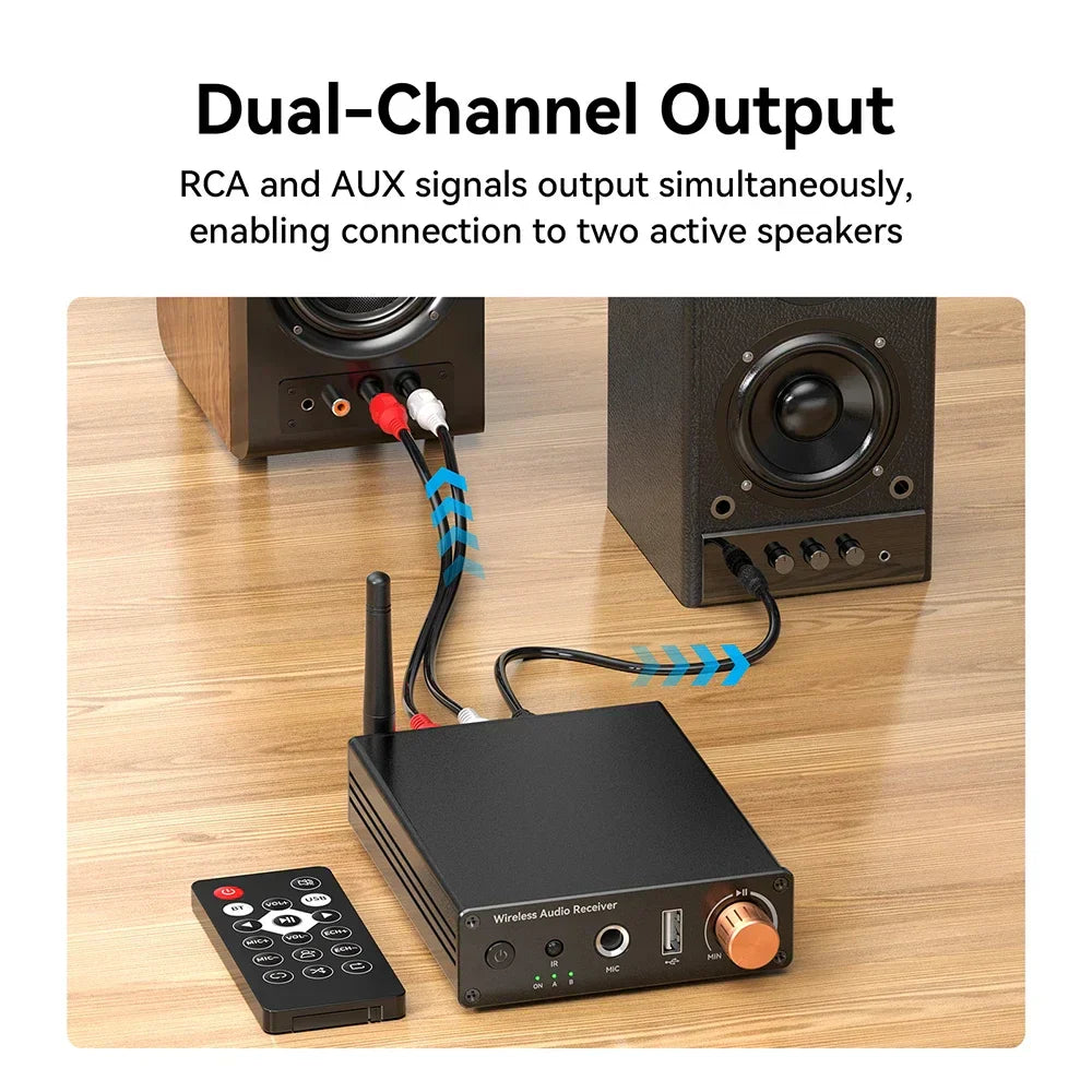 Black bluetooth-compatible 6.0 music wireless adapter with copper volume knob connected to powered speakers amplifiers via rca cables