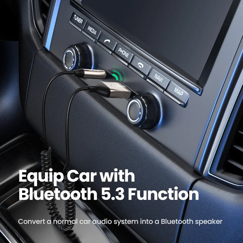 Black and silver bluetooth 5.3 car bt transmitter with coiled cable plugged into stereo for kits aux audio jack music wireless