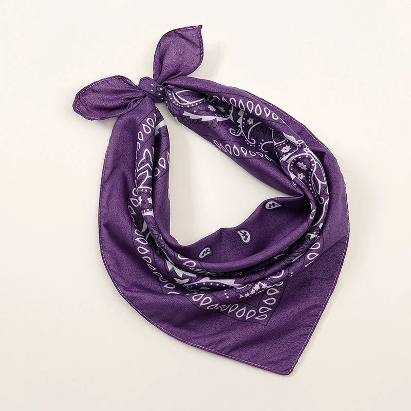 Purple bohemian print bandana with white paisley tied in a knot for printed headbands hiphop wrist wraps face use