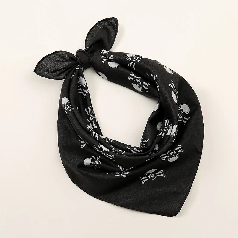Black skull-patterned bohemian print bandana tied in a knot suitable as printed headbands hiphop wrist wraps face mask