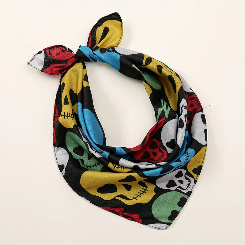 A vibrant black silk bohemian print bandana with multicolored skulls ideal as printed headbands hiphop or wrist wraps face mask