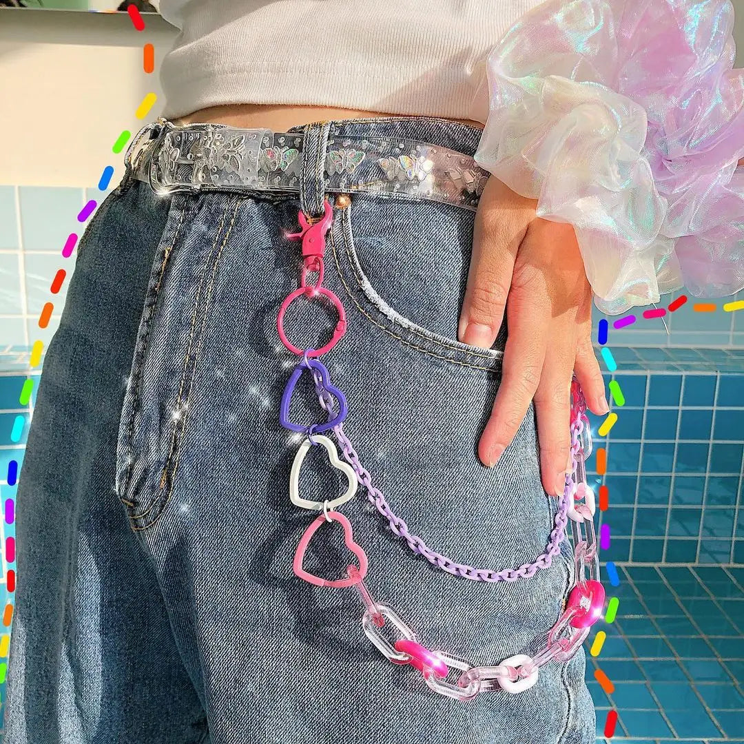 A colorful bohemian rainbow resin waist chain multicolor with a translucent heart-shaped resin buckle and pink purple links