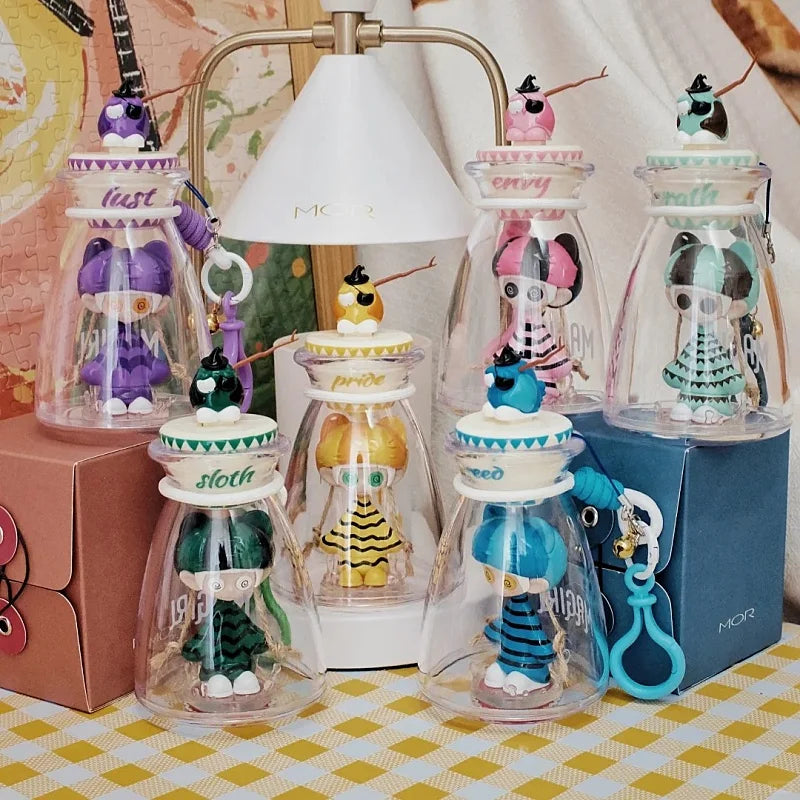 Clear glass jar with white lid labeled pride containing a yellow glow in the dark cute horror figure model gift toy