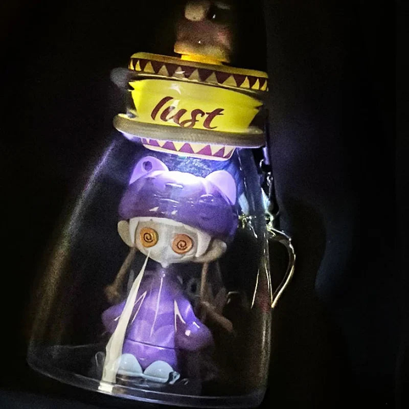 Purple plastic cute horror figure with spiral eyes and yellow sombrero cap in bottle music blind glow in the dark toy gift